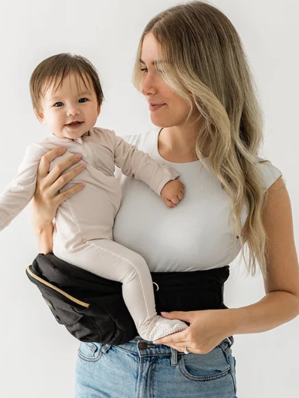 The Tushbaby Hip Carrier black and gold